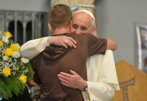 Pope_Francis_hugs_a_man_in_his_visit_to_a_rehab_hospital