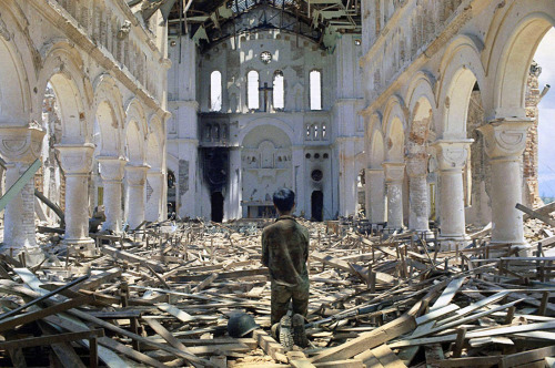A man praying in a ruined Catholic church in La Vang, a town south of Quang Tri City, Vietnam on July 6, 1972.